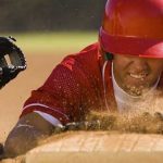player sliding into base representing How to Get Recruited to Play College Baseball